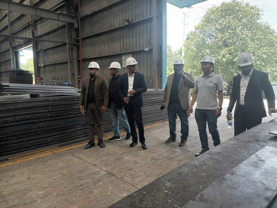 On the production floor with visitors
